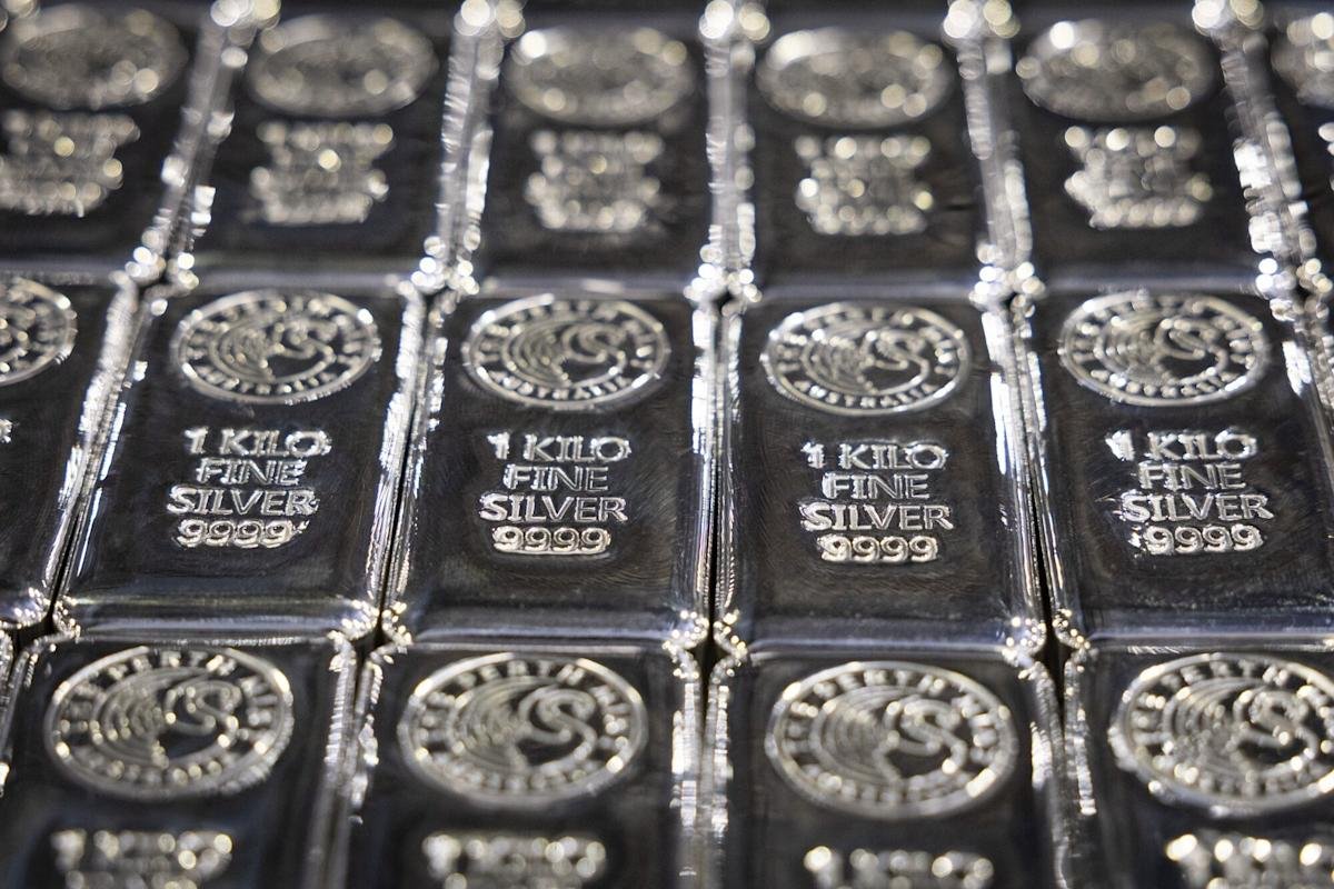Gold and silver prices fall after record rally