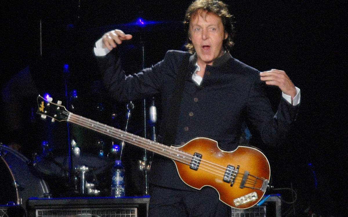 paul mccartney playing bass guitar